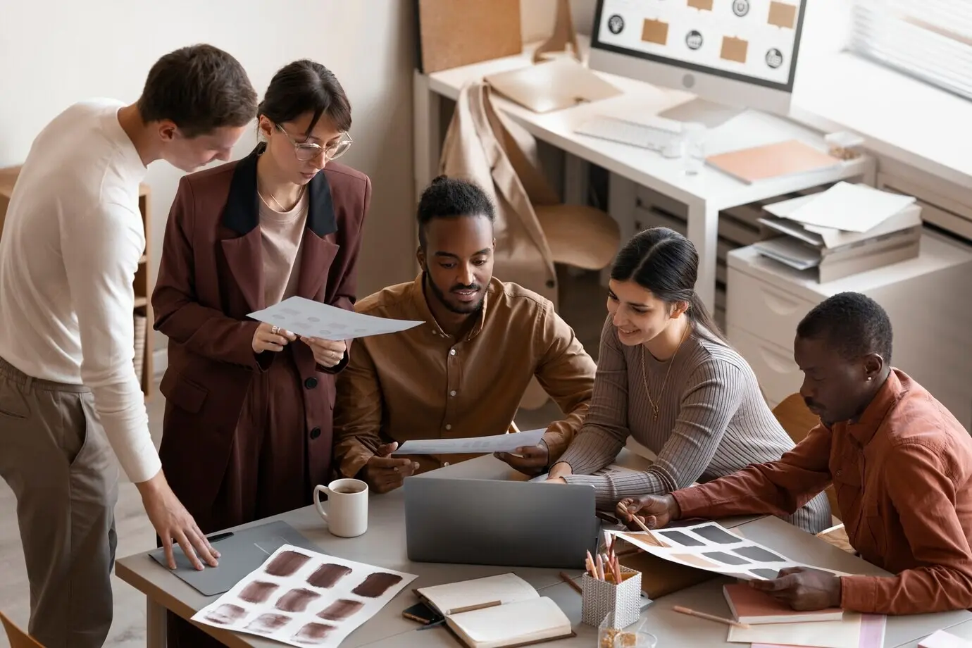 High-angle view of people working at a desk